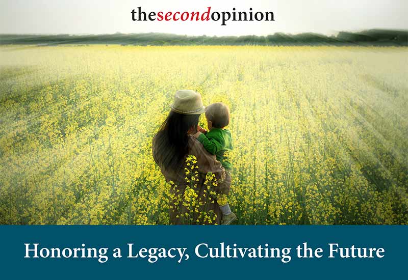 woman holding child in field